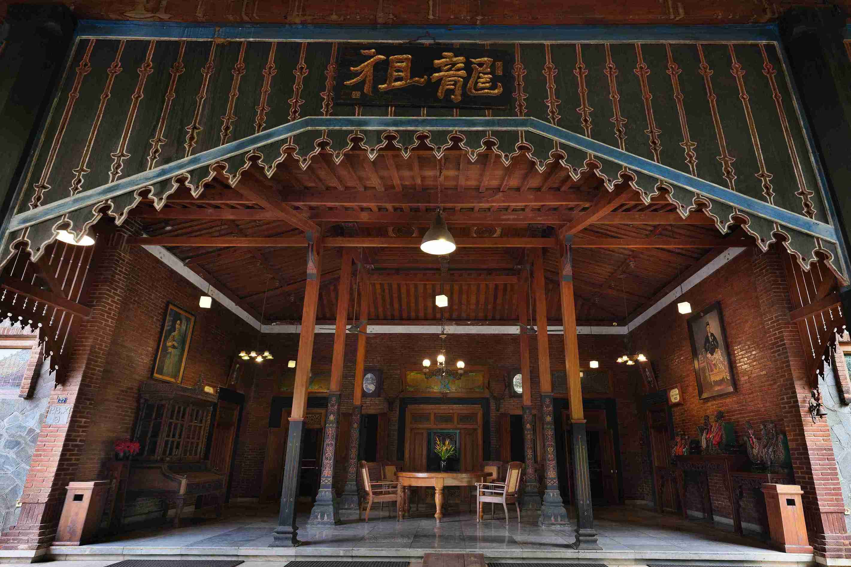 Traditional Javanese Joglo Pendopo with Carved Wooden Pillars